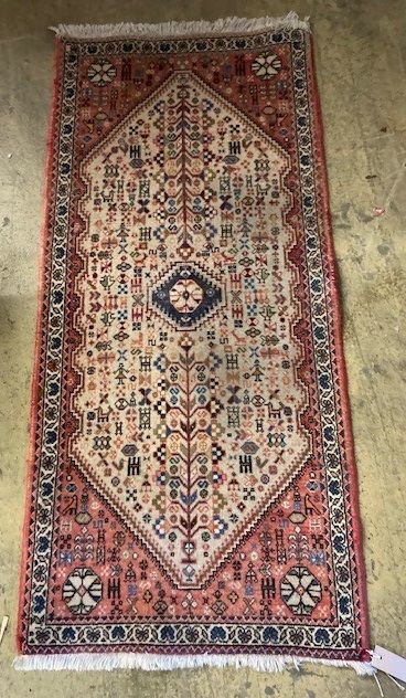 A Hamadan peach ground rug, 144 x 66cm
